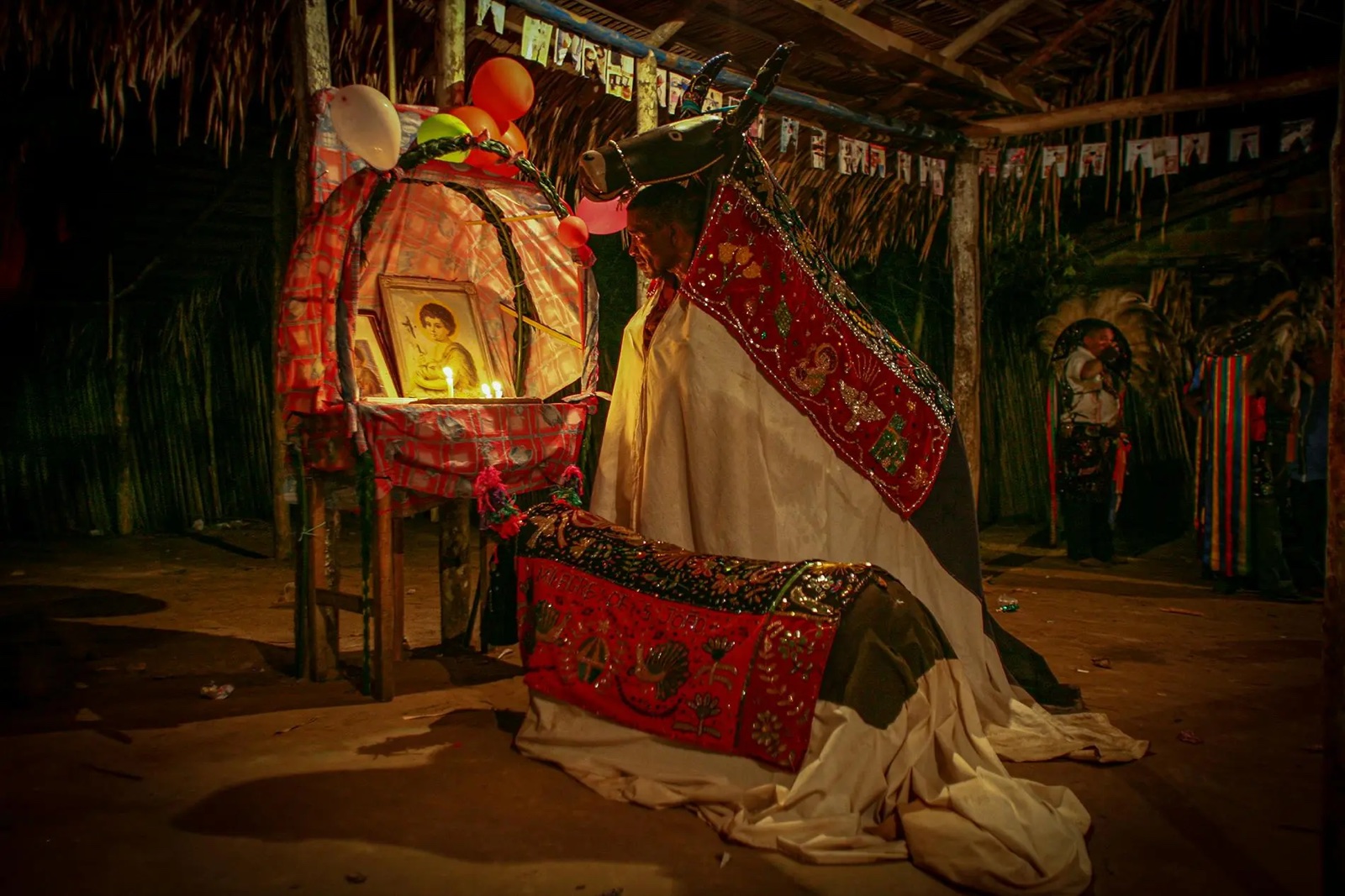 Márcio Vasconcelos — photographic work bringing ritual costume, offerings, plus sacred space into one nocturnal scene by Márcio Vasconcelos